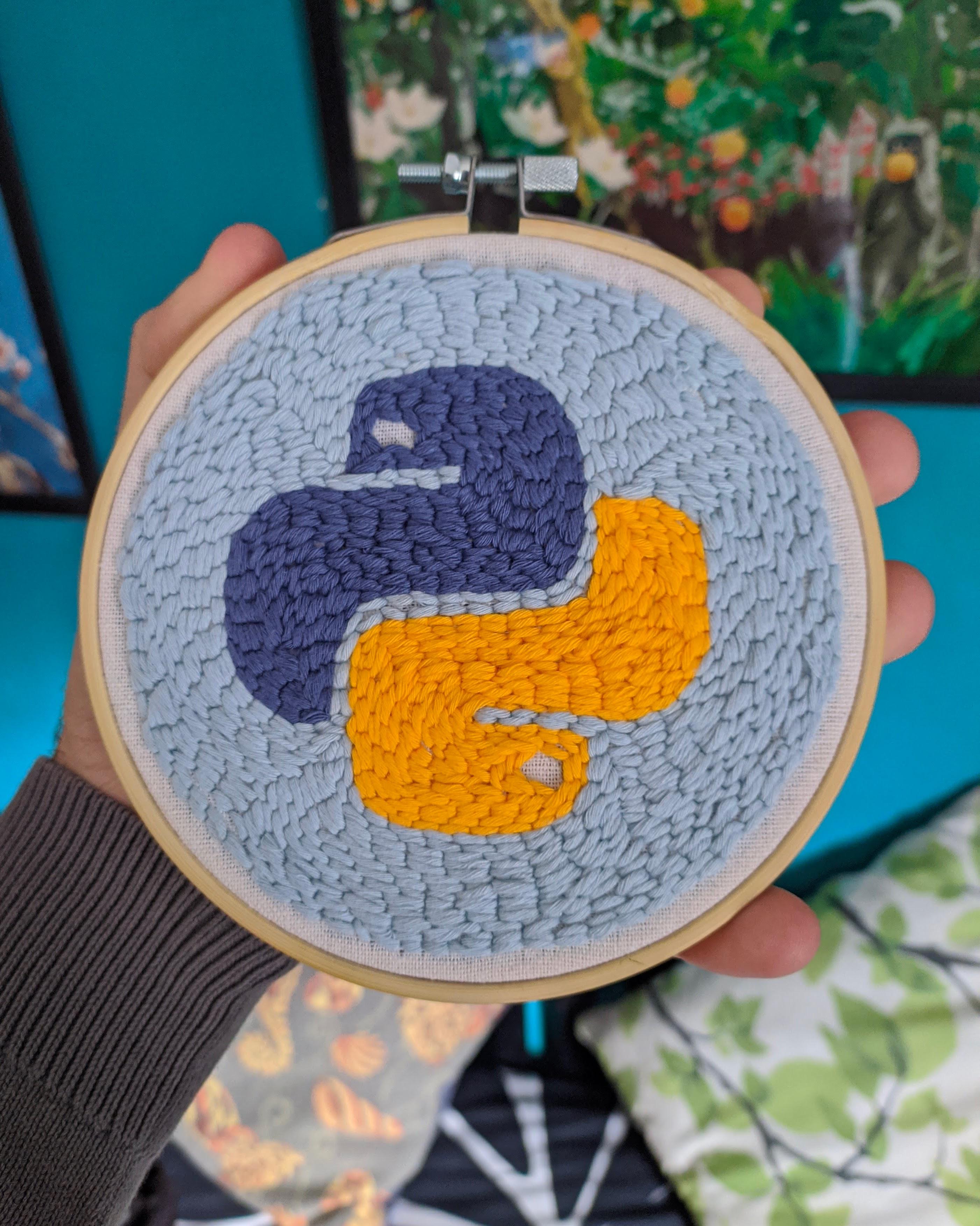 My girlfriend made this Python logo with punch-needle. | python-memes | ProgrammerHumor.io