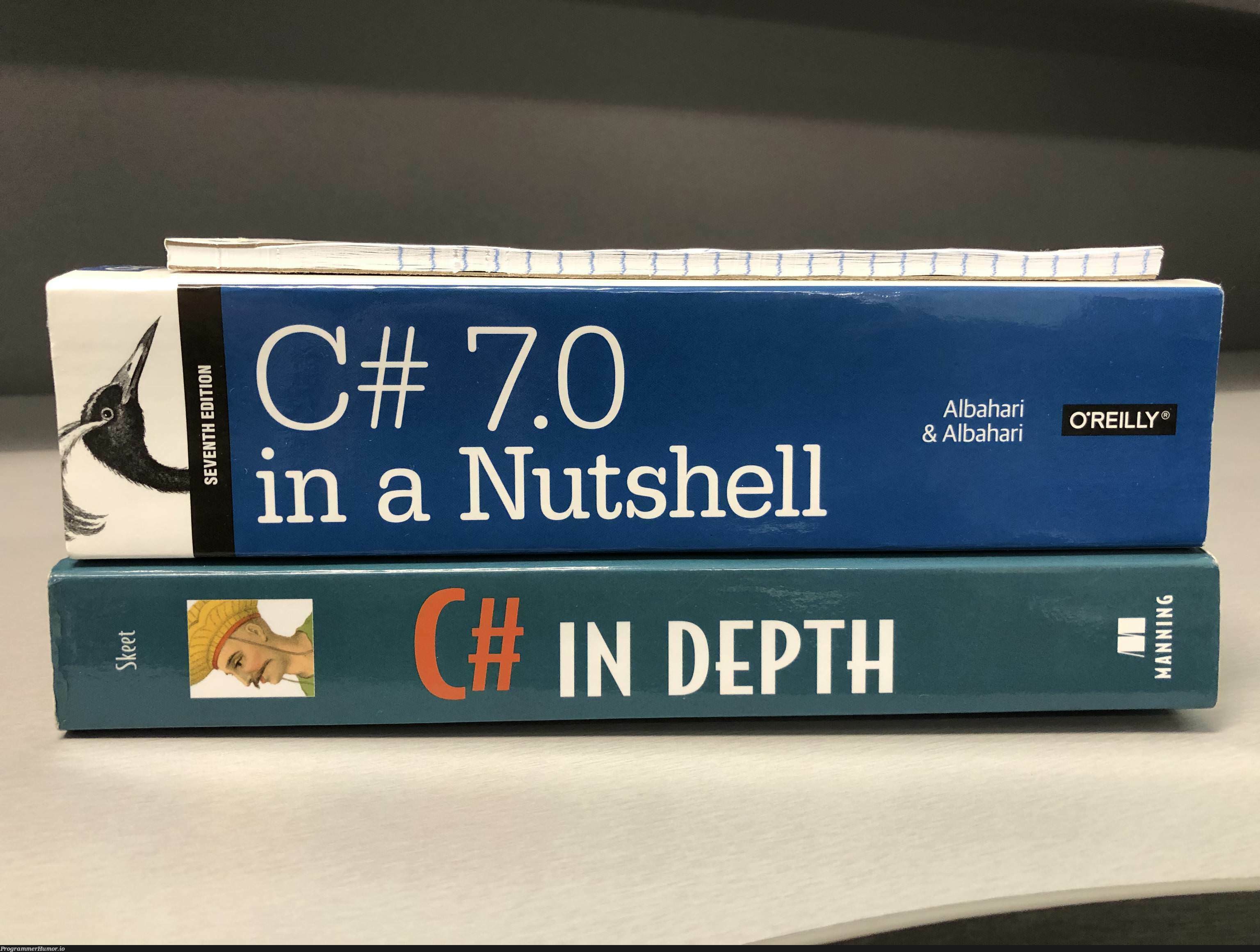 I feel like one of these books is misleading me | shell-memes | ProgrammerHumor.io